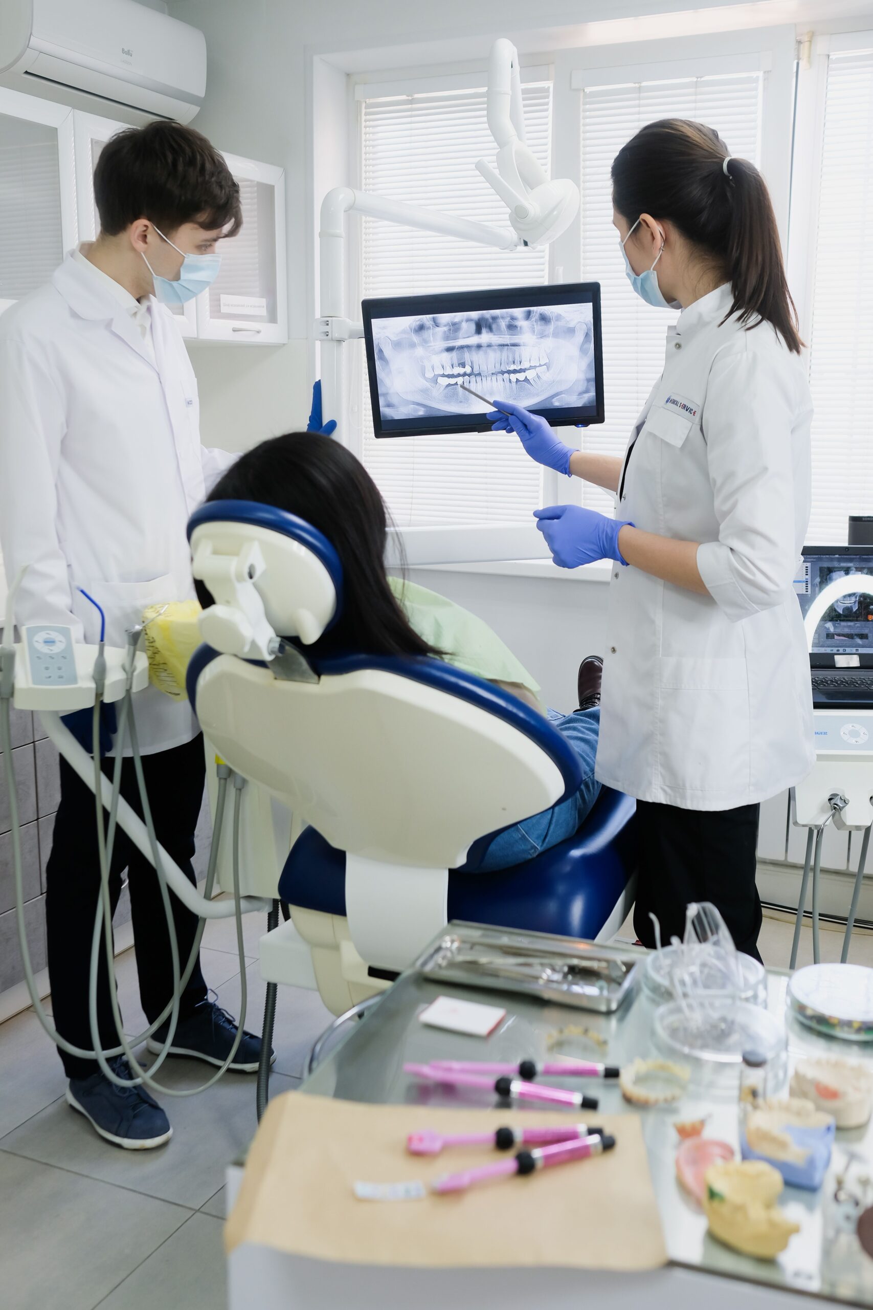 Dentists reviewing imaging with a patient at Integrated Aesthetic Dentistry
