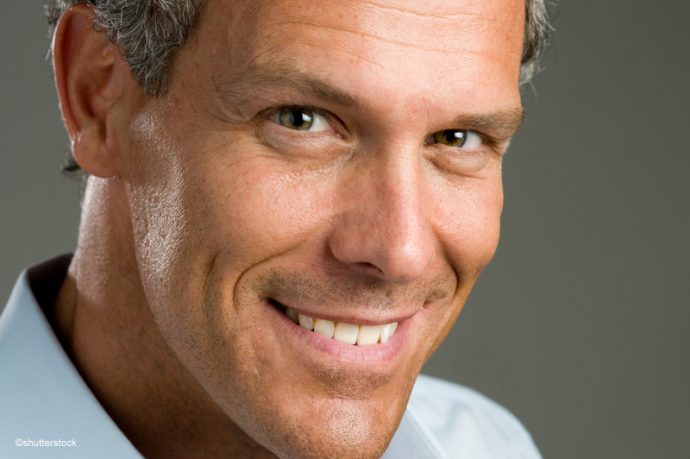 Smiling man after successful dental implant treatment