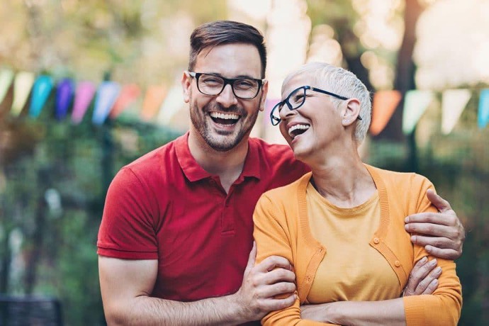 appy patients smiling outdoors after dental treatment
