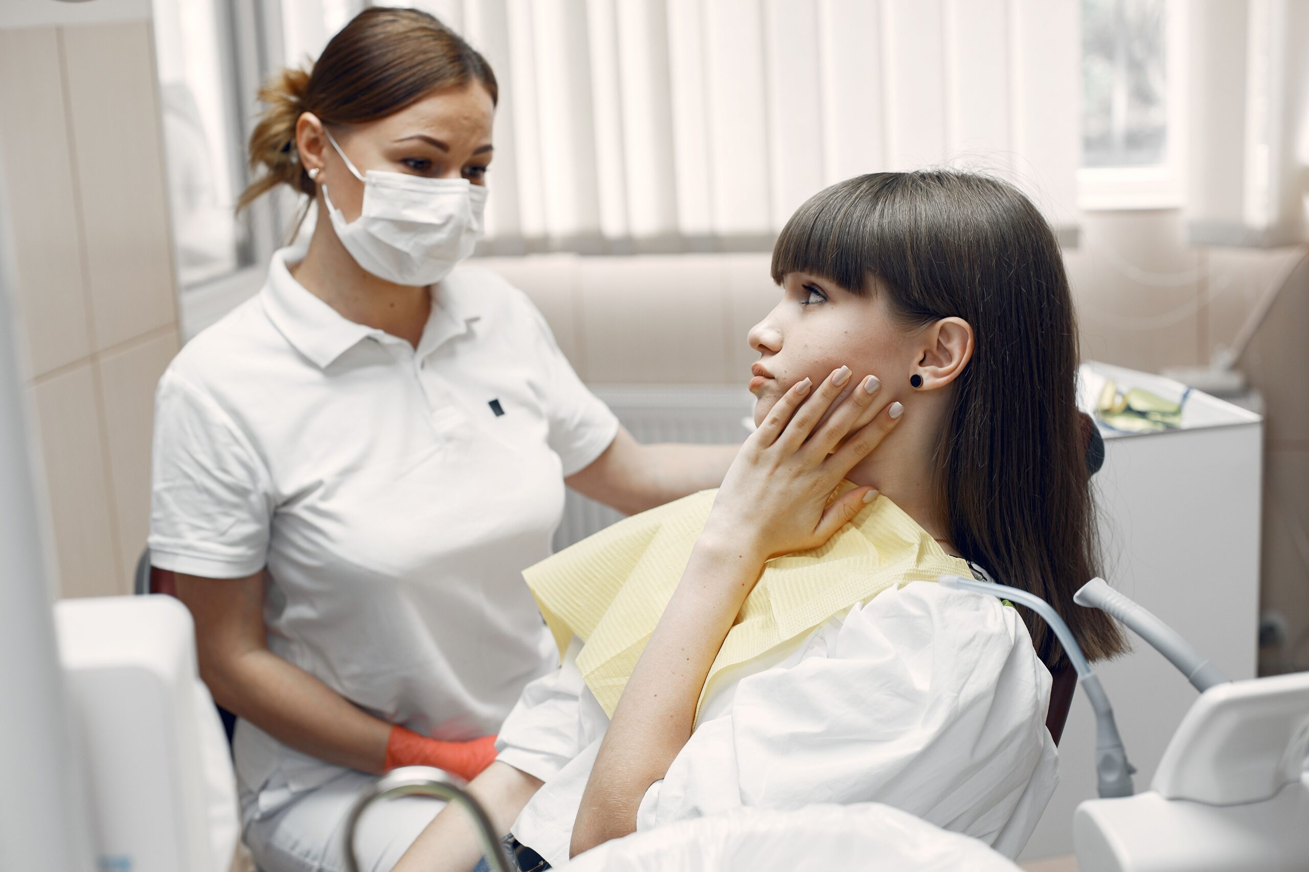 Dentists reviewing imaging with a patient at Integrated Aesthetic Dentistry