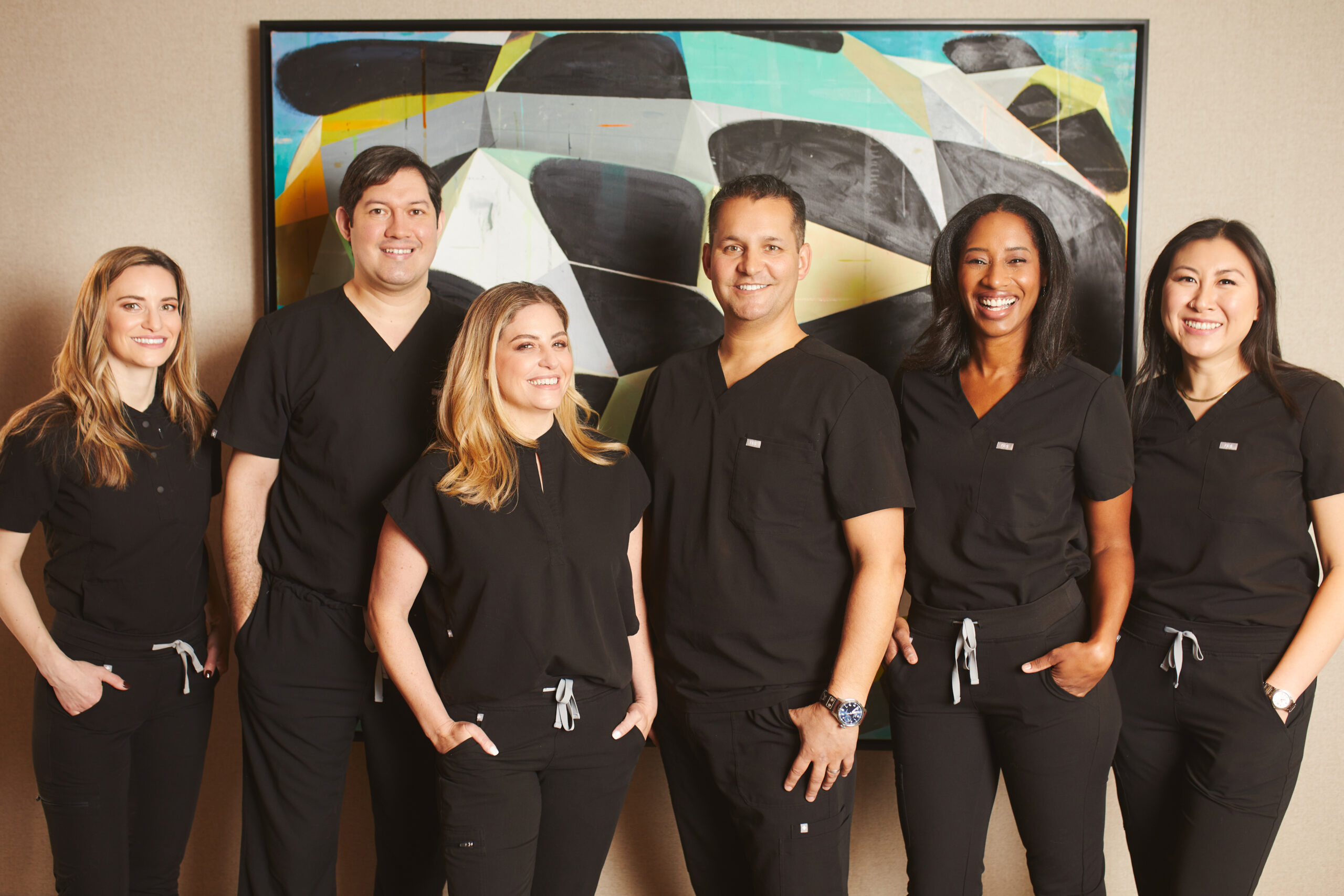 Dentists reviewing imaging with a patient at Integrated Aesthetic Dentistry